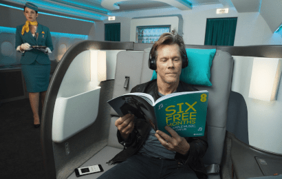 Kevin Bacon sitting on an aeroplane